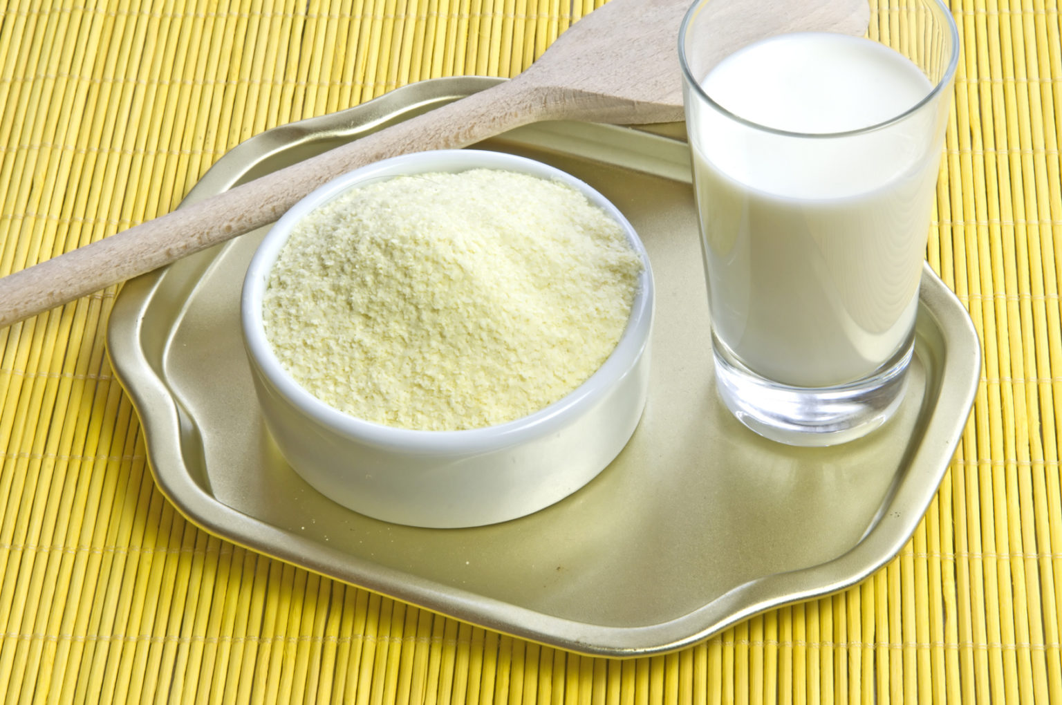 Powdered milk and a glass of milk