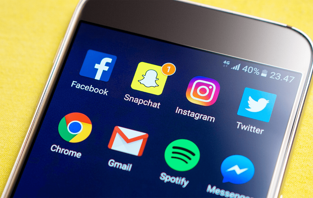 Phone displaying social media and messaging applications