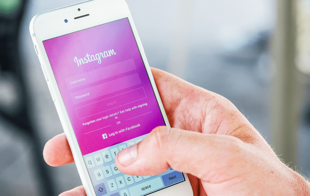 Person signing in to a social media account on a phone