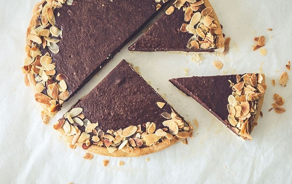 Soft chocolate tart cut into clean slices