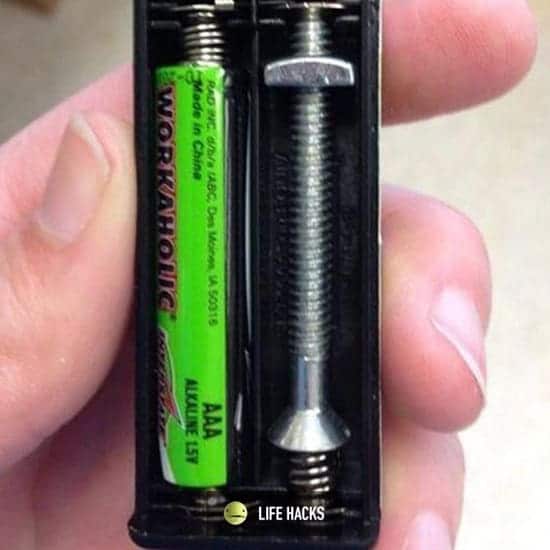 Bolt used as a battery compartment spacer