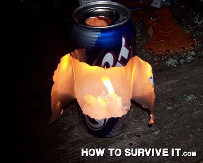 Small open flame burning inside a cut aluminum can