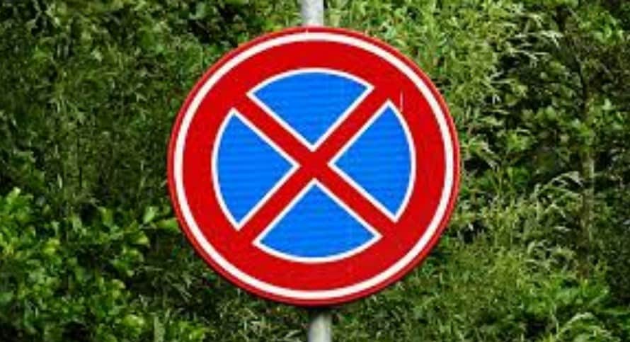 Red and blue roadside restriction sign