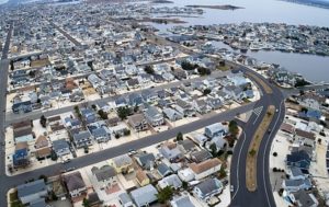 Aerial view of a coastal residential area and roadway