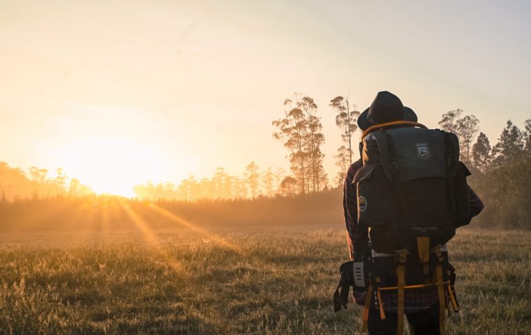 Prepared hiker carrying a large outdoor survival backpack