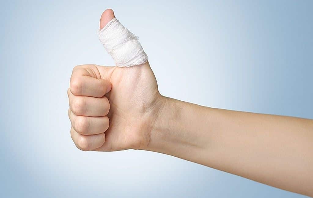 Bandaged injured thumb