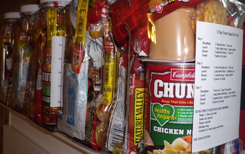 Organized emergency food stocks in containers and on shelves