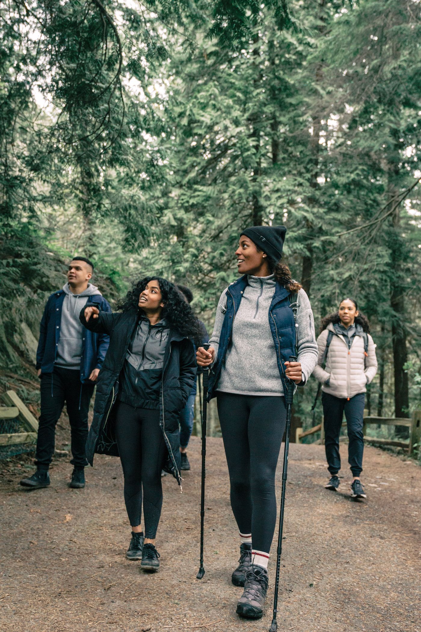 Group of hikers practicing together on a forest trail