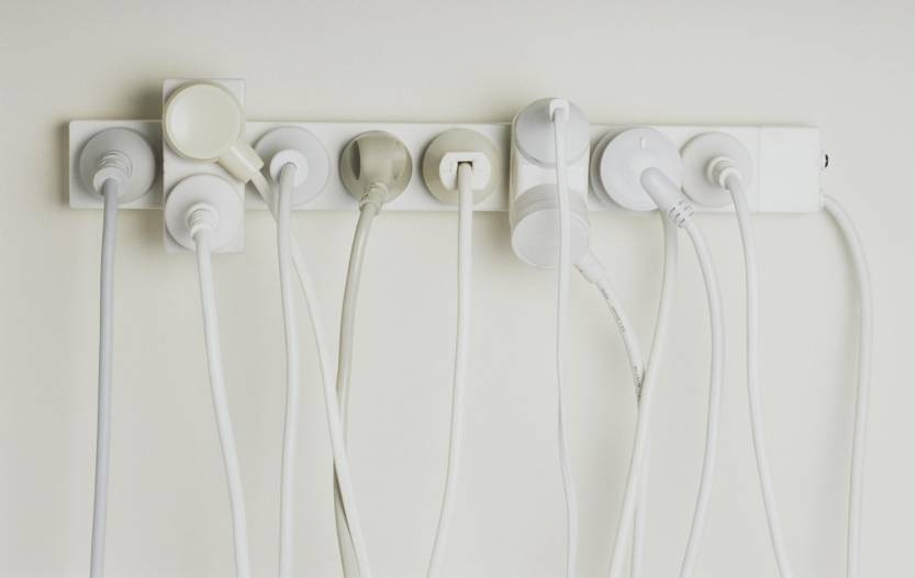 Several electrical appliances plugged into one power strip