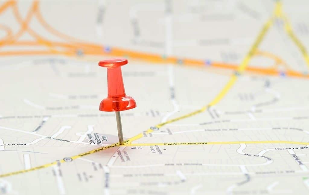 Red location pin on a detailed city map