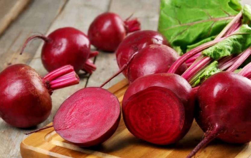 beets sliced on a wooden chopping board