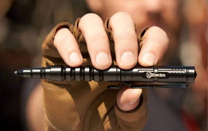 Guy holding up The Atomic Bear SWAT Tactical Pen