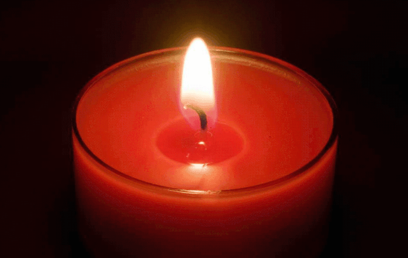 A lit orange candle
