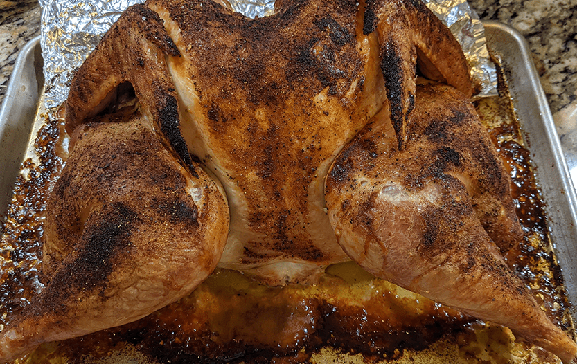 Spatchcocked and dry brined turkey before being carved crispy a nd beautiful